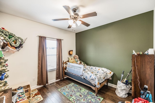 bedroom featuring dark hardwood / wood-style flooring and ceiling fan