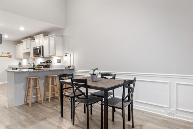 dining room with light hardwood / wood-style floors