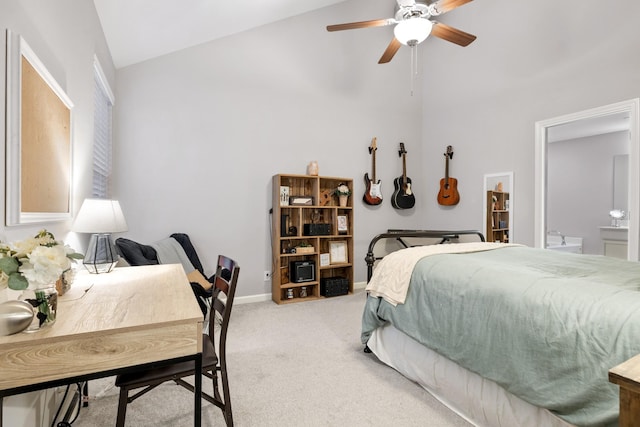 carpeted bedroom featuring ensuite bathroom, high vaulted ceiling, and ceiling fan