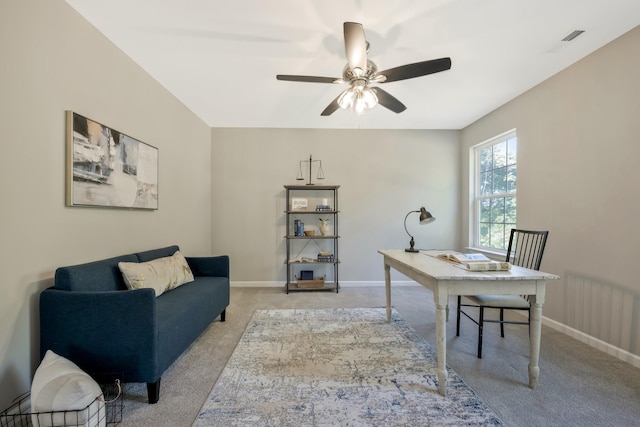 office space with light colored carpet and ceiling fan