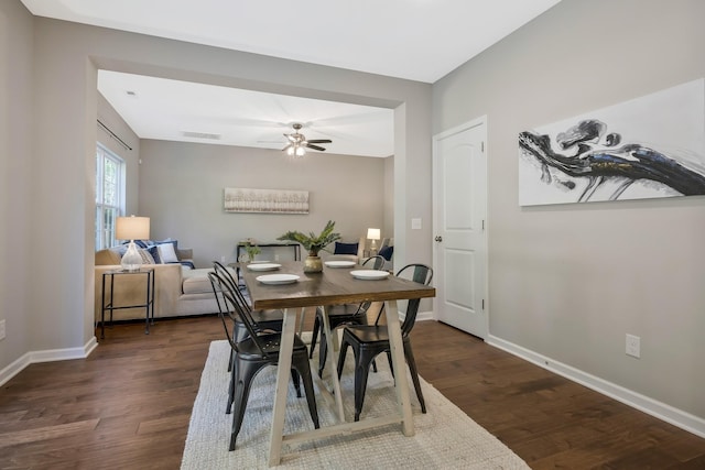 dining space featuring dark hardwood / wood-style flooring and ceiling fan