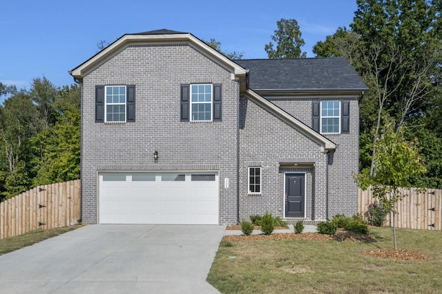 front facade with a front lawn and a garage