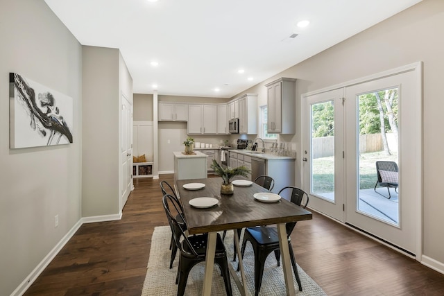 dining area featuring dark hardwood / wood-style flooring and sink