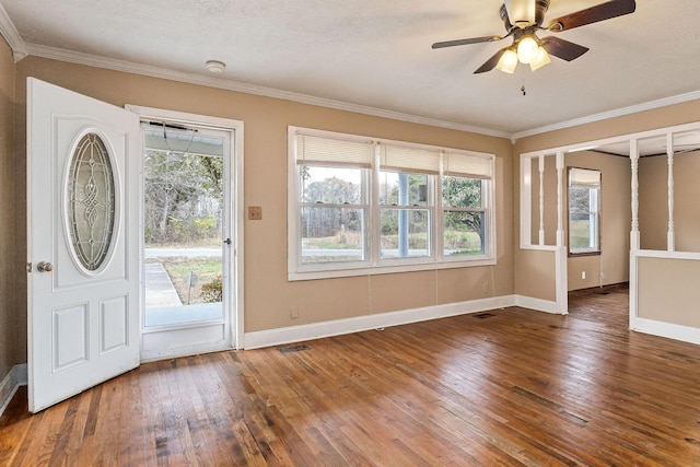 foyer entrance with ceiling fan, ornamental molding, a textured ceiling, and hardwood / wood-style flooring