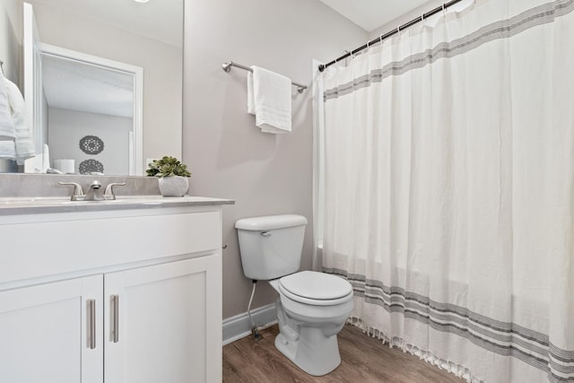 bathroom featuring hardwood / wood-style floors, vanity, and toilet