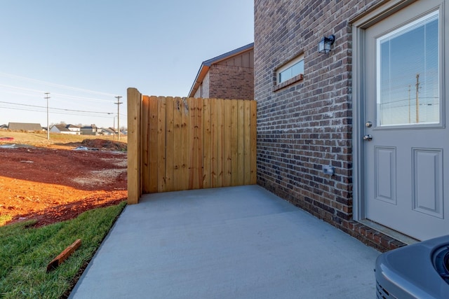 entrance to property featuring a patio area