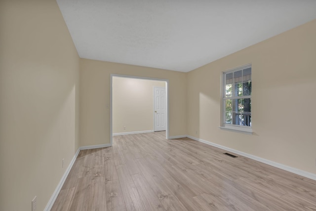 spare room with light wood-type flooring