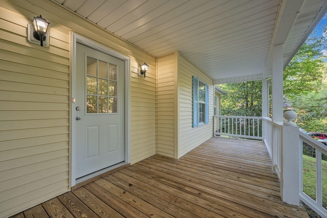 wooden terrace featuring a porch