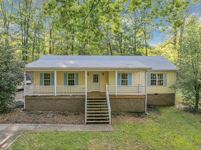 single story home with a front yard and a porch