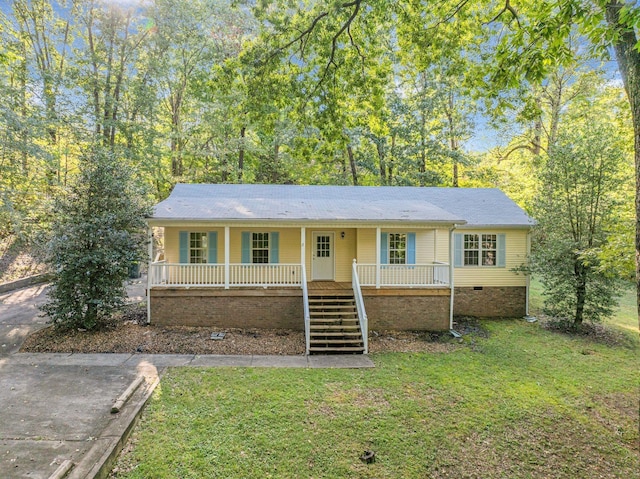 single story home with covered porch and a front yard