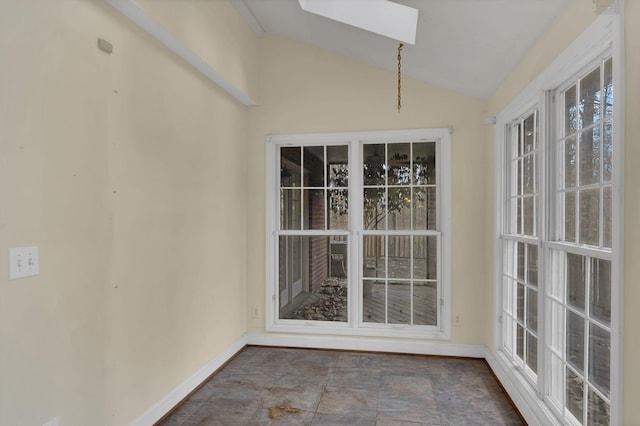 unfurnished sunroom featuring lofted ceiling