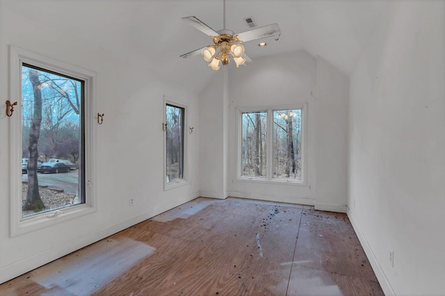 spare room featuring a wealth of natural light, ceiling fan, and lofted ceiling