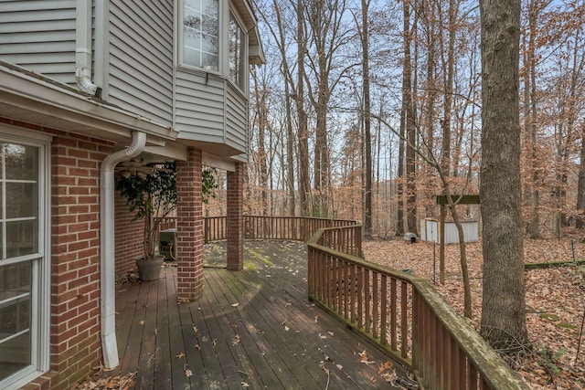 wooden deck with a shed