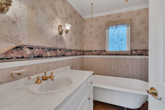 bathroom featuring a washtub, vanity, and ornamental molding