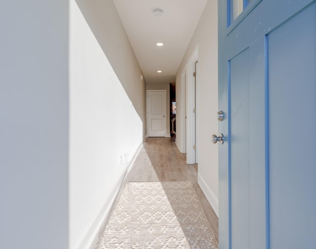 corridor featuring light wood-type flooring