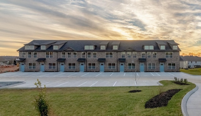 view of outdoor building at dusk