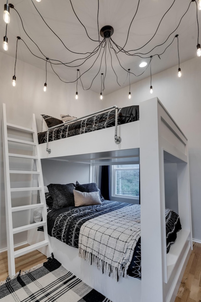 bedroom with hardwood / wood-style floors