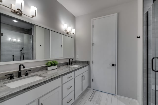 bathroom with vanity and an enclosed shower