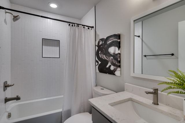 full bathroom with shower / tub combo with curtain, vanity, and toilet