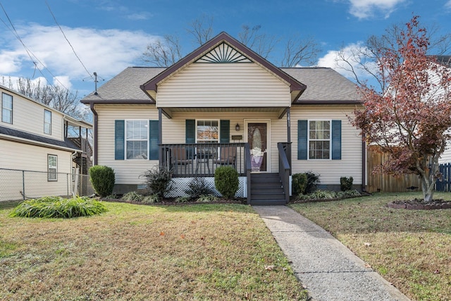 bungalow-style home featuring a front yard and a porch