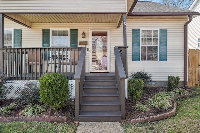 property entrance featuring covered porch