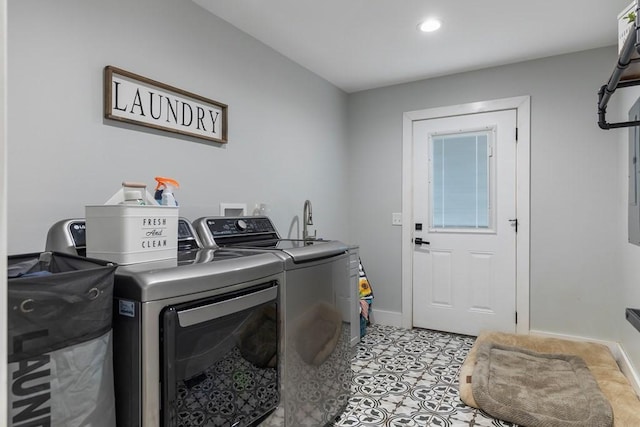 clothes washing area featuring independent washer and dryer