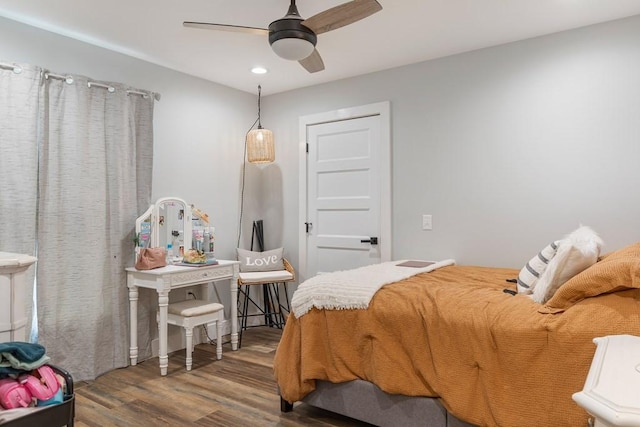 bedroom with hardwood / wood-style floors and ceiling fan