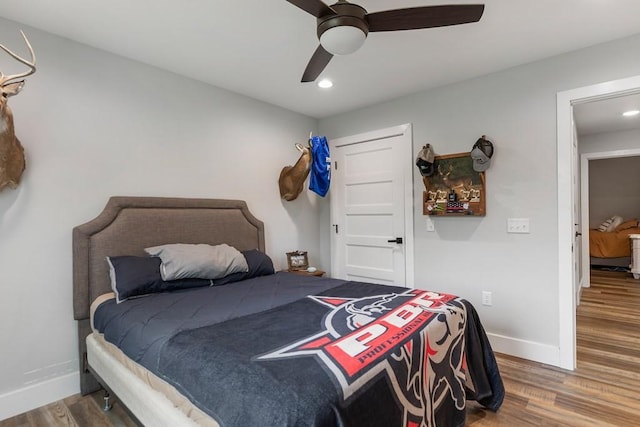 bedroom featuring ceiling fan and wood-type flooring