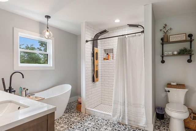 bathroom featuring toilet, vanity, tile patterned floors, and curtained shower