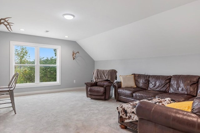 living room featuring light carpet and lofted ceiling