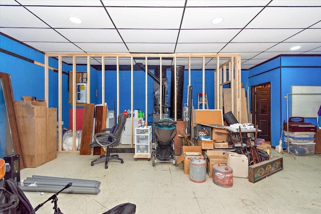 interior space with a paneled ceiling