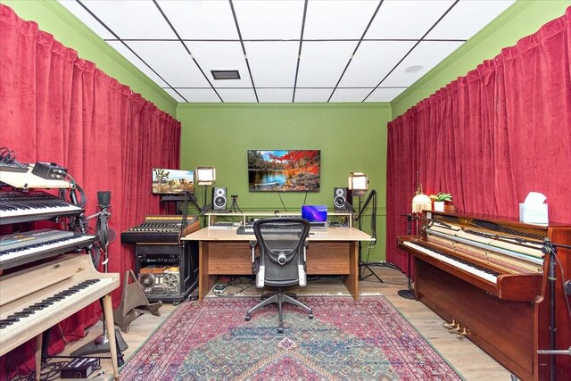 home office featuring light hardwood / wood-style flooring and ornamental molding