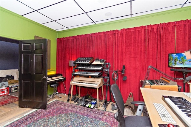 misc room with hardwood / wood-style flooring and crown molding