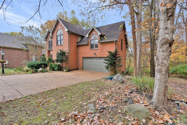 view of side of property with a garage