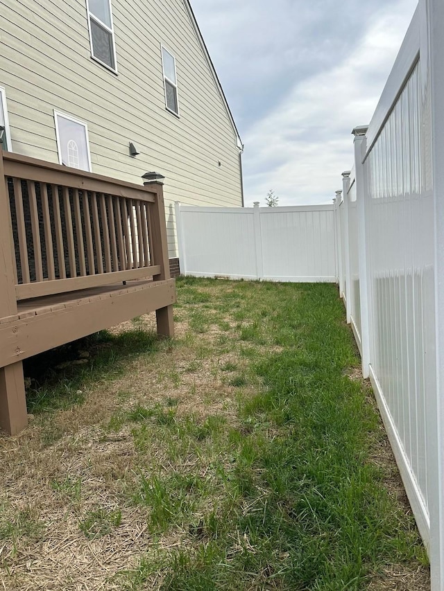 view of yard with a wooden deck