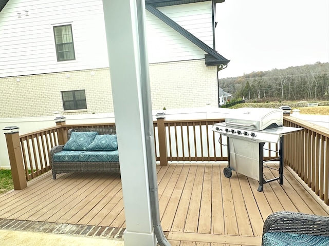 wooden deck featuring grilling area