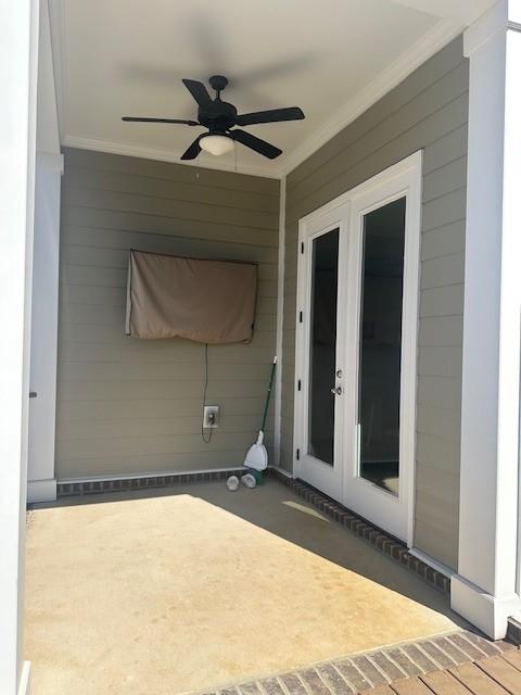 view of patio featuring french doors and ceiling fan