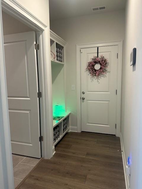 mudroom featuring visible vents and wood finished floors