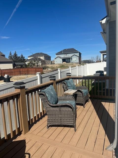 deck with a fenced backyard