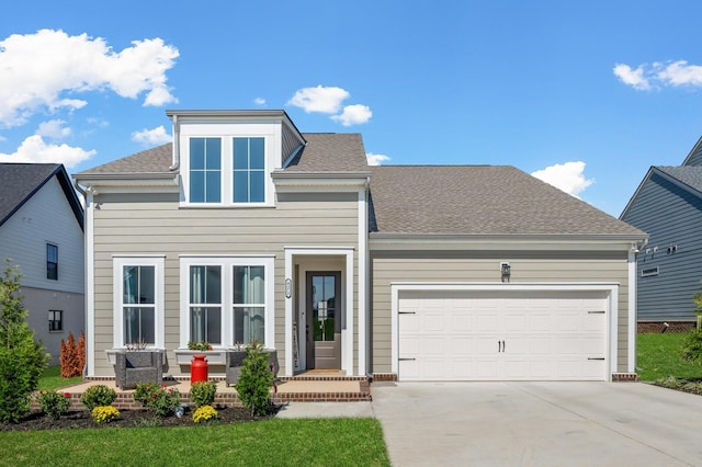 view of front facade featuring driveway, a garage, and roof with shingles