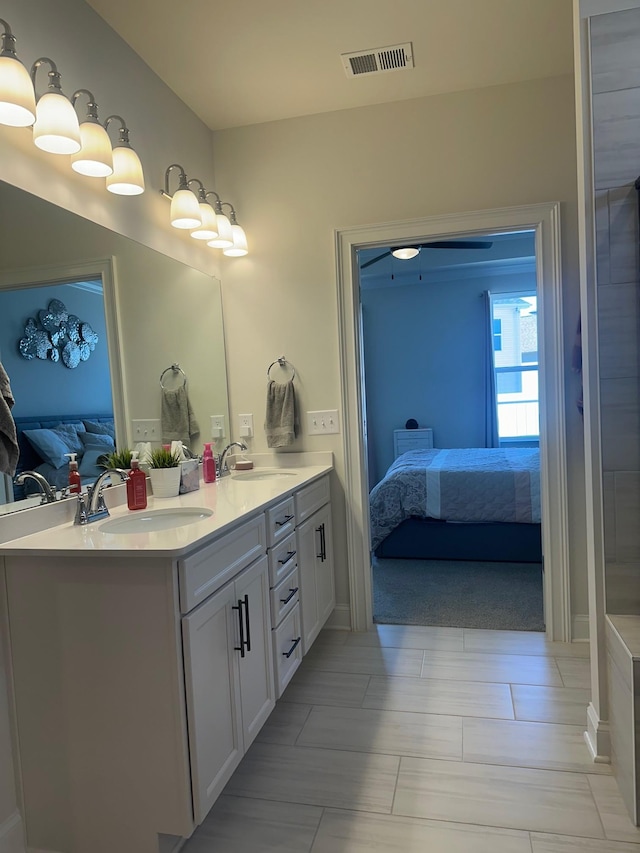 ensuite bathroom with visible vents, vanity, and ensuite bathroom