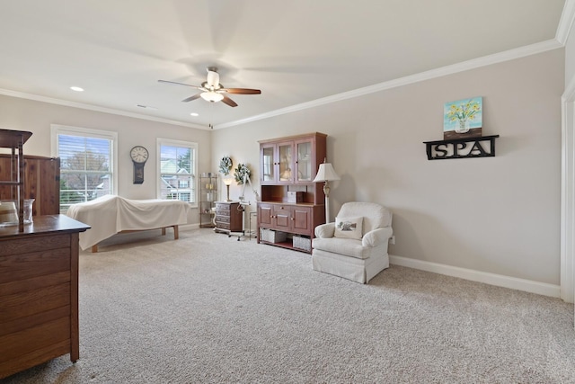 bedroom featuring light colored carpet, ceiling fan, and crown molding