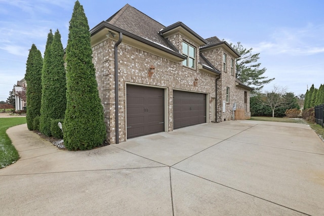 view of property exterior with a garage