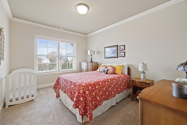 carpeted bedroom featuring crown molding