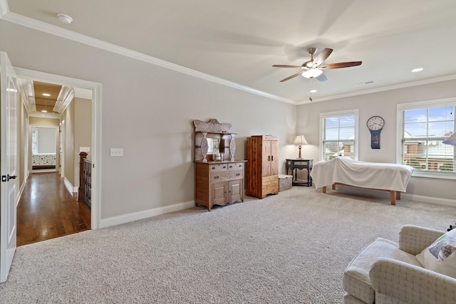 bedroom with ceiling fan, crown molding, and hardwood / wood-style flooring