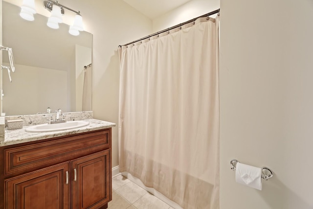 bathroom with tile patterned flooring and vanity