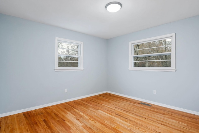 unfurnished room featuring light hardwood / wood-style floors