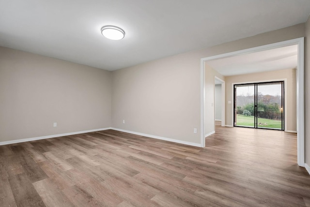 unfurnished room featuring light hardwood / wood-style floors