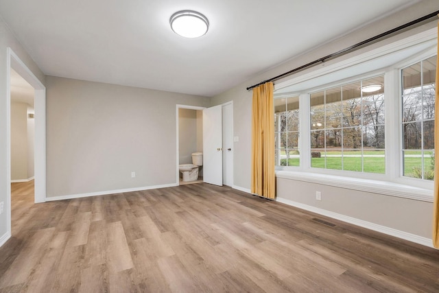 spare room with light hardwood / wood-style floors