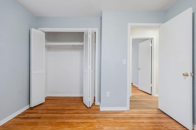 unfurnished bedroom featuring light wood-type flooring